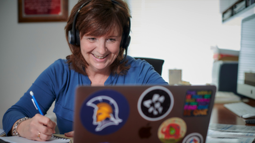 UNCG professor Dr. Marcie Rock works on a computer